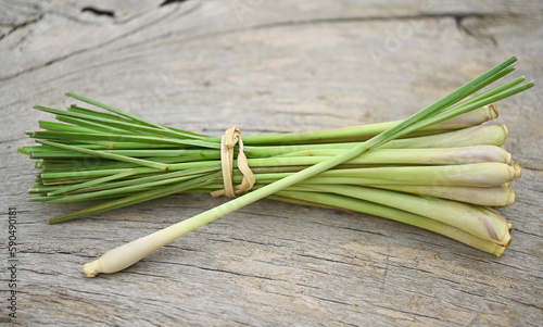Fresh lemongrass on wooden texture in cooking concept and herbal food.
