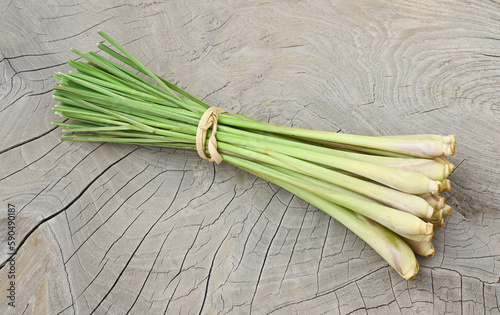 Fresh lemongrass on wooden texture in cooking concept and herbal food.