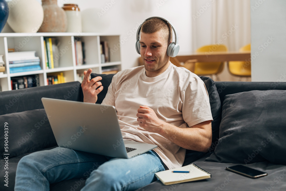 A young businessman is working on his laptop. A young businessman is working on his laptop.