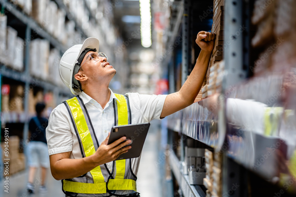 Foto de Warehouse Worker using digital tablets to check the stock