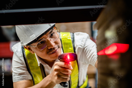 Warehouse workers use scanner checking and scan the barcode of stock inventory to keep storage in a system, Smart warehouse management system, Supply chain and logistic network technology concept.