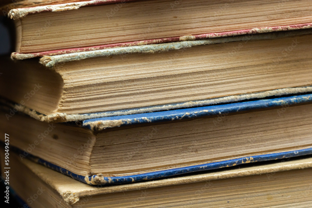 Book background. Stack of books in the library. Old yellow pages of paper books. Learning and knowledge Book background. Stack of books in the library. Old yellow pages of paper books. Learning and knowledge