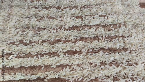 White cereals rice and stripes for background and texture. Product and food stored for a long time. Partial focus