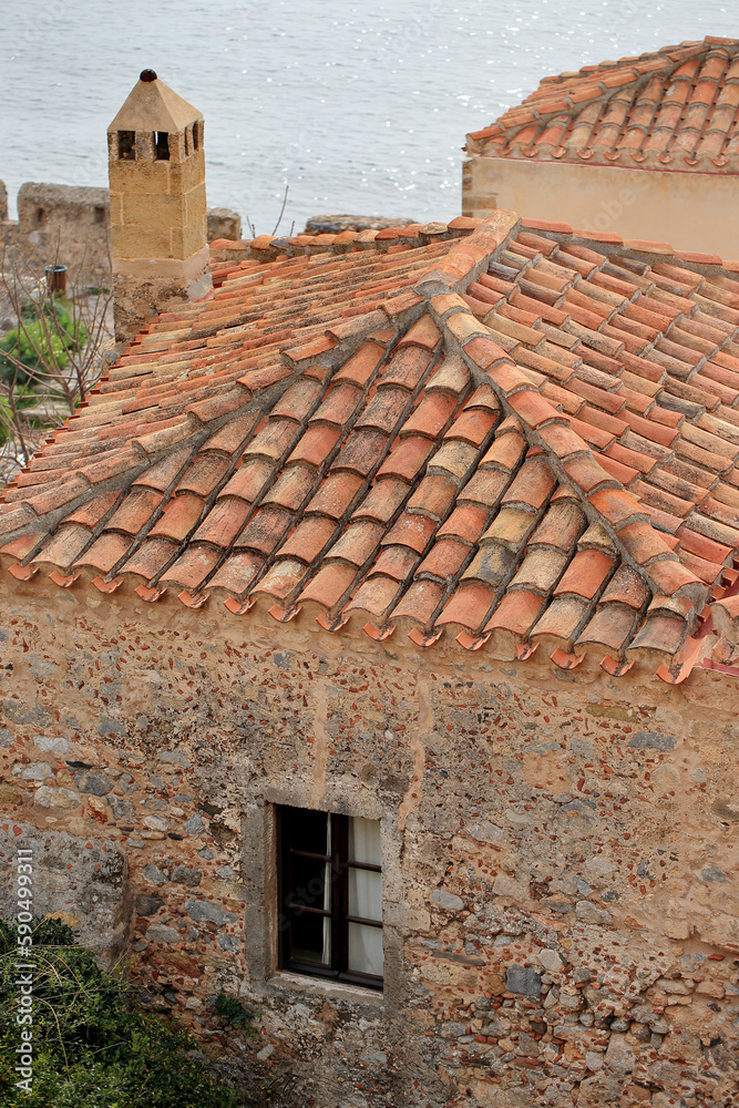 Monemvasia - roofs and chimneys of tenement houses from Byzantine times in Monemvasia in Peloponnese (Greece)