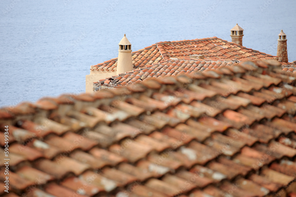 Monemvasia - roofs and chimneys of tenement houses from Byzantine times in Monemvasia in Peloponnese (Greece)