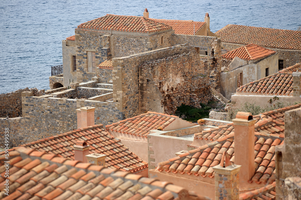 Monemvasia - roofs and chimneys of tenement houses from Byzantine times in Monemvasia in Peloponnese (Greece)