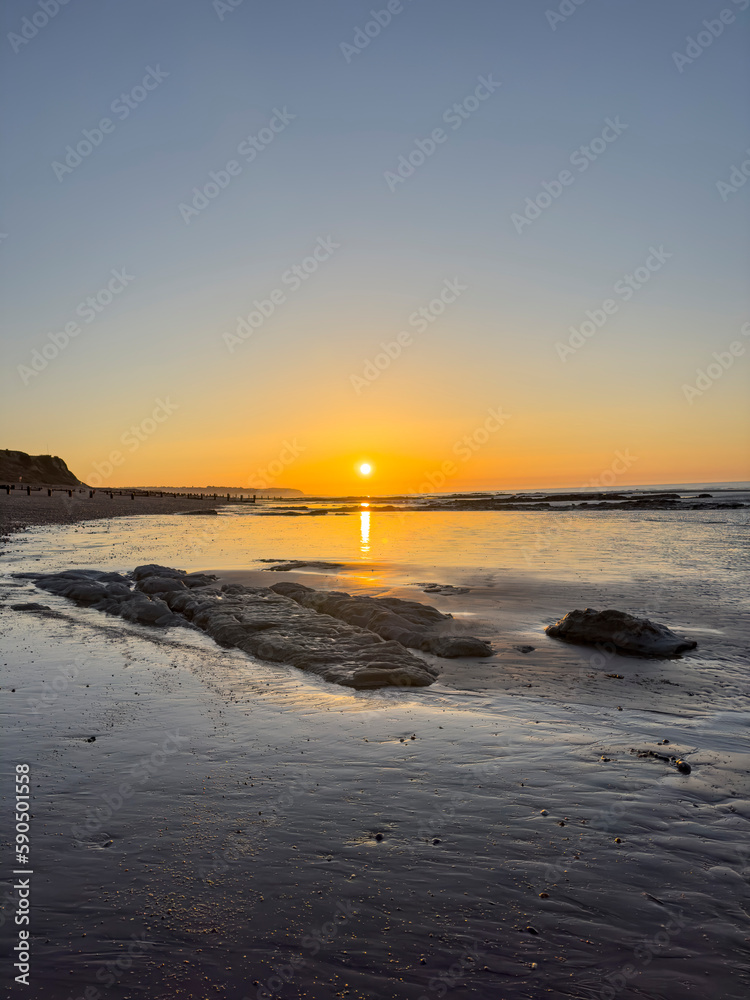 Sunrise at low tide at Bexhill, East Sussex, England