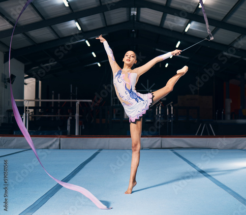Ribbon, gymnastics and portrait of woman in dancing performance, training and sports competition. Female, rhythmic movement and flexible dancer balance in action, creative talent and concert in arena