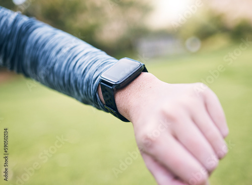 Smart watch, closeup person and fitness outdoor at park, exercise and running in nature. Stopwatch, hands and runner check time, heart rate and monitor healthy training progress, clock or sports gear