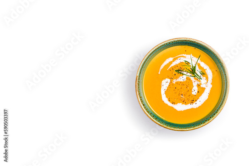 Pumpkin soup isolated on white background. Top view. Copy space.