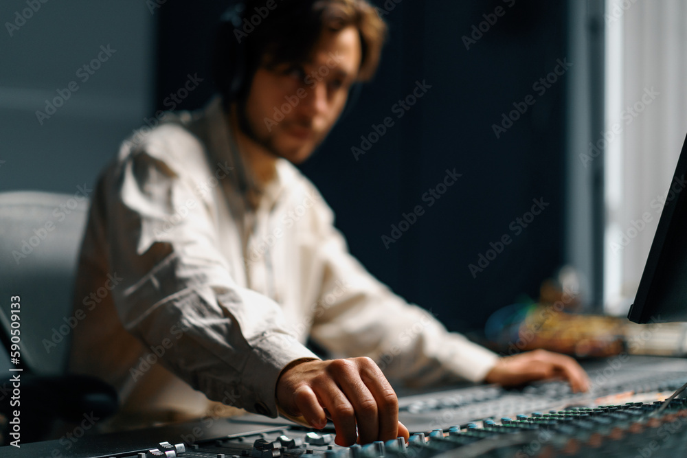Fototapeta premium Sound engineer used digital audio mixer Sliders Engineer presses keys Control panel Recording studio technician