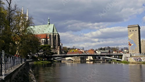 Neisse river in Görlitz. Old Town Bridge connects Görlitz with Zgorzelec. St. Peter and Paul church in the background. 