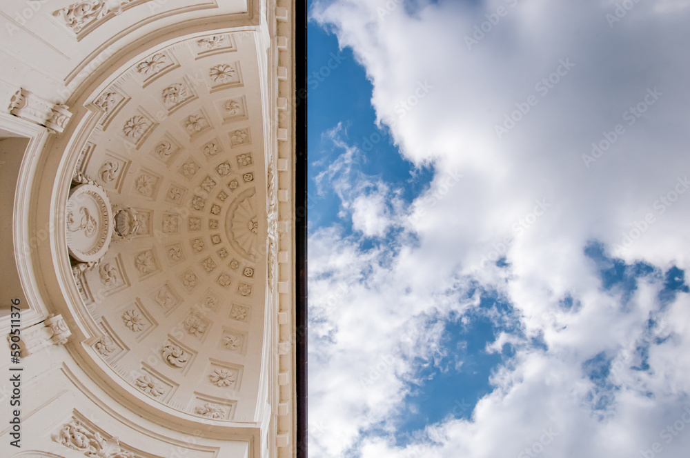 Close-up of a building with a neoclassical ceiling against the sky. Neoclassical architecture, rococo with hemispherical ceiling and stucco. Lazienki Park, Warsaw, Poland
