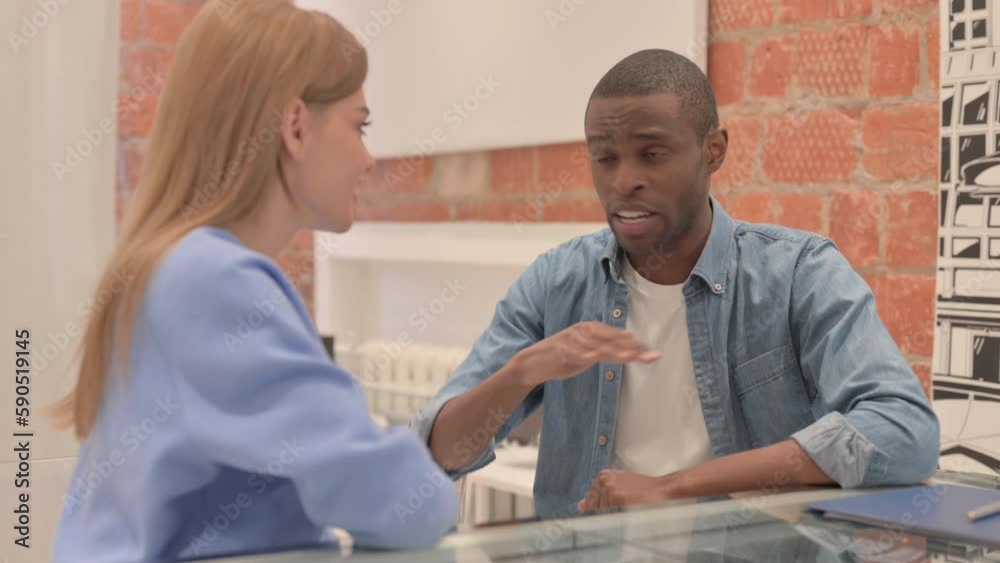 African Man Talking with Caucasian Woman, Sitting at Home African Man Talking with Caucasian Woman, Sitting at Home