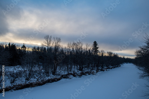 Winter sunrise over frozen river