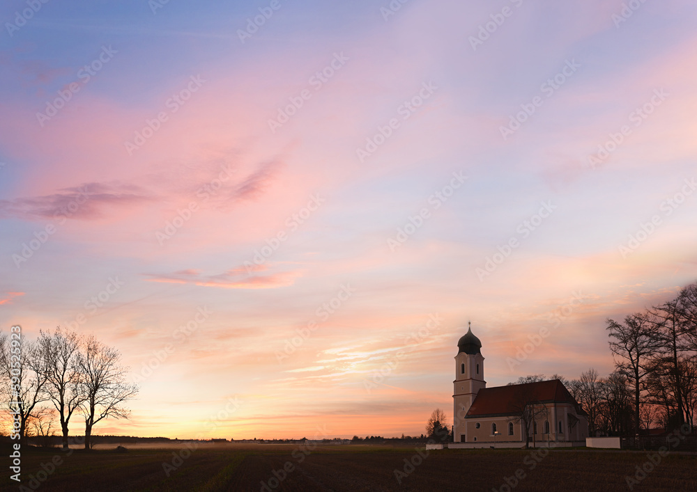 sunset sky background rural landscape with church and copy space