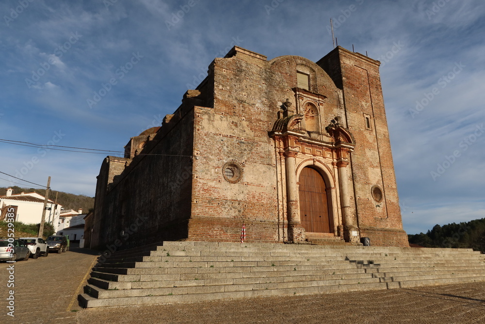 Castano del Robledo, Huelva, Spain, March 30, 2023: Main facade and stairs of the unfinished Church (18th century) of Castano del Robledo, Huelva. Spain