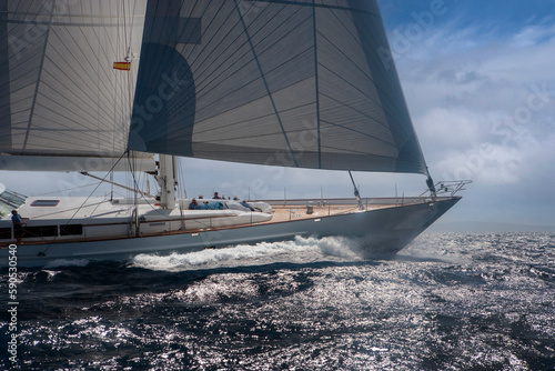 Super sailing yacht in full sail. Power sailing. Sailing at sea. Action.  © A