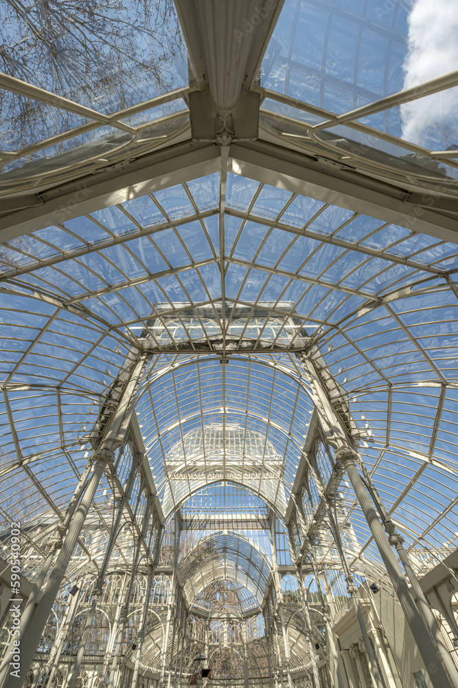 a palace with glass walls in the Retiro park in Madrid