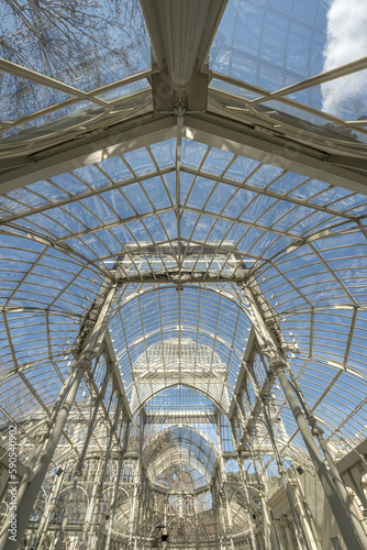 a palace with glass walls in the Retiro park in Madrid