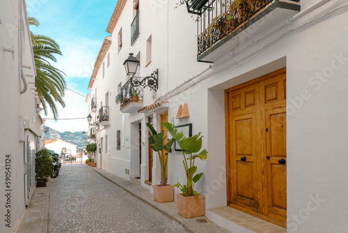 Fototapeta Naklejka Na Ścianę i Meble -  Altea old town with narrow streets and whitewashed houses. Architecture in small picturesque village of Altea near Mediterranean sea, Alicante province, Valencian Community, Spain