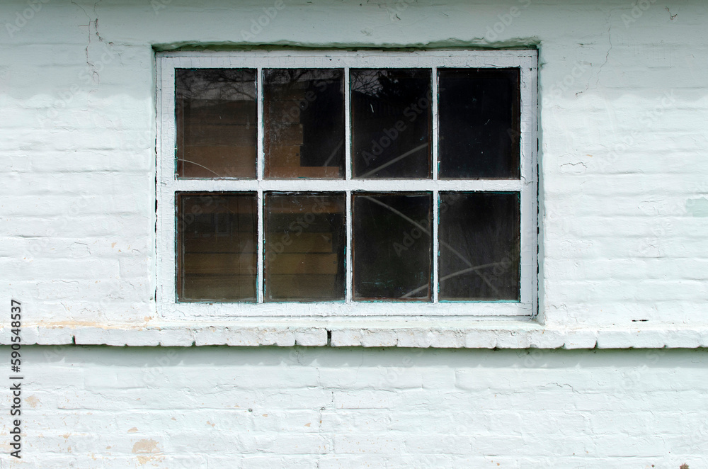 Fototapeta premium Brick wall of a building with window