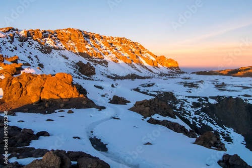Scenery, snow and ice on trail on the slope of Mount Kilimanjaro