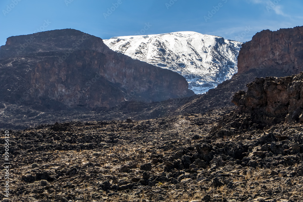 Scenery, rock piles and hiking trail on the slope of Mount Kilimanjaro