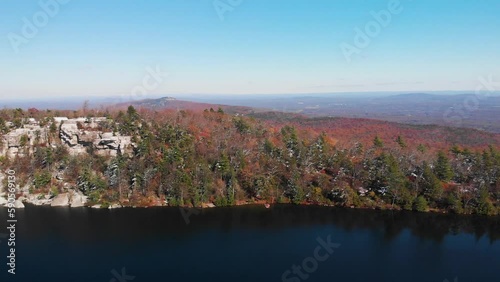 Beautiful lake amids the forest aerial footage winter new york upstate