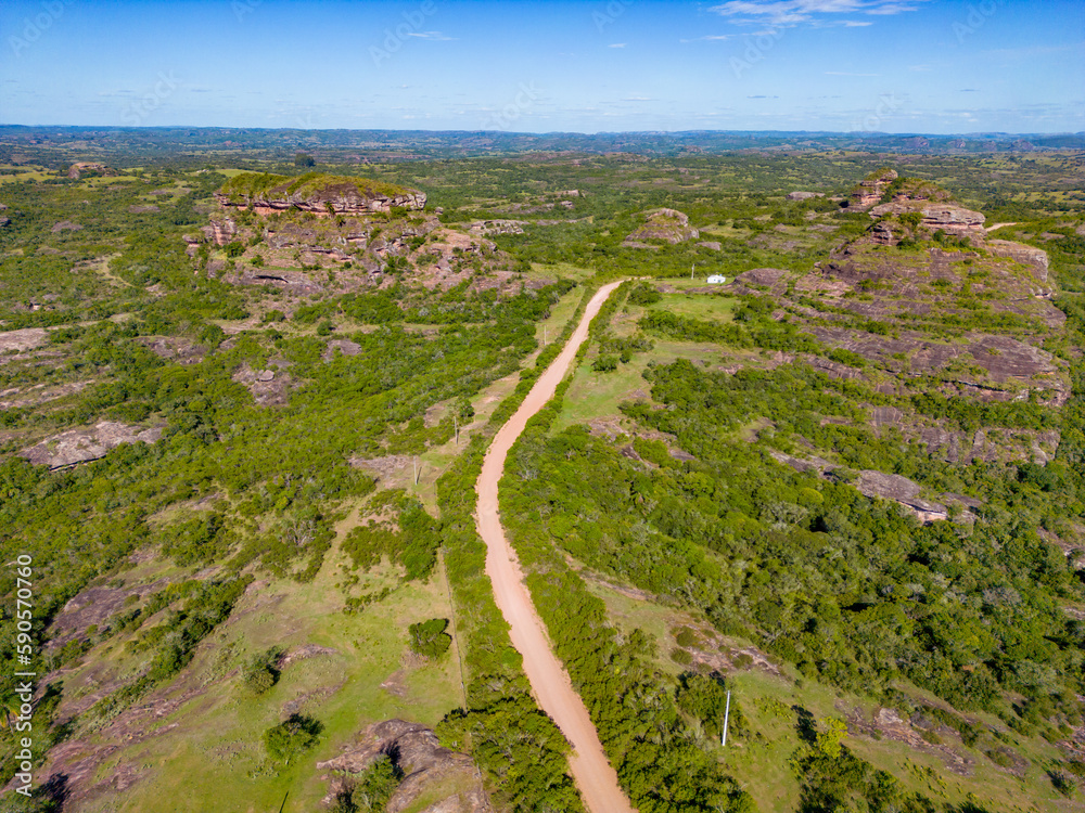 Aerial view of dirty road, Geological formations and forest