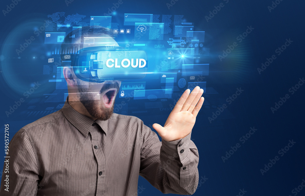 Businessman looking through Virtual Reality glasses Businessman looking through Virtual Reality glasses