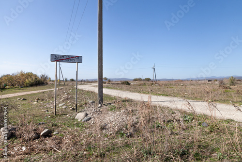landscape with village sign, Georgia, Nikozi, South Ossetia