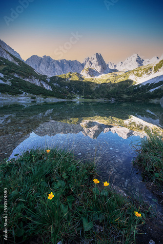 Reflections at the Dragen Lake in the Alps photo