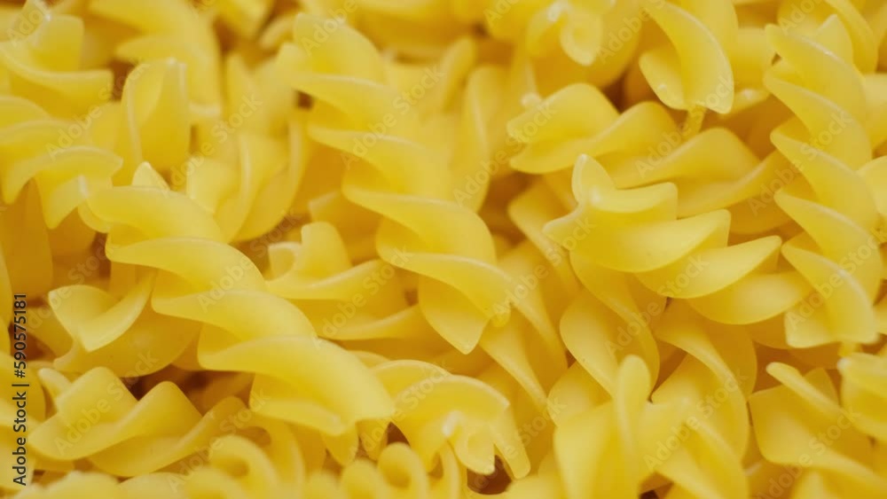 Fusilli pasta from durum wheat, in the form of spirals, whirl, top view. Fusilli pasta from durum wheat, in the form of spirals, whirl, top view.