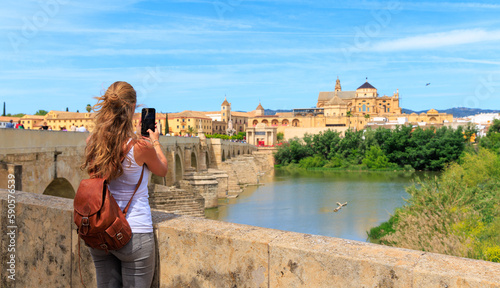 Woman tourist taking picture of Cordoba cathedral, Spain, andalusia photo