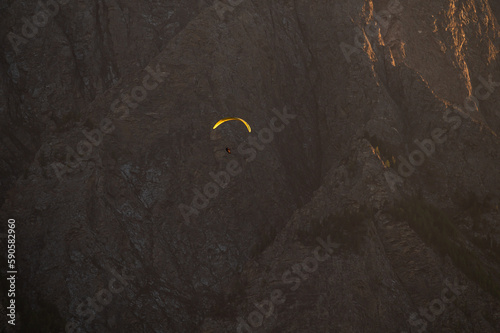 Wallpaper Mural paraglider sports infront of mountain, adventure during misty colorful sunset light Torontodigital.ca