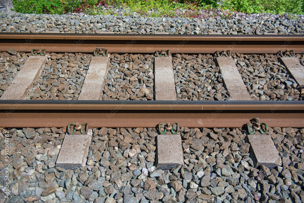 The iron rails are covered with rubble