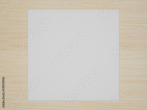 A square white square paper on a wooden table