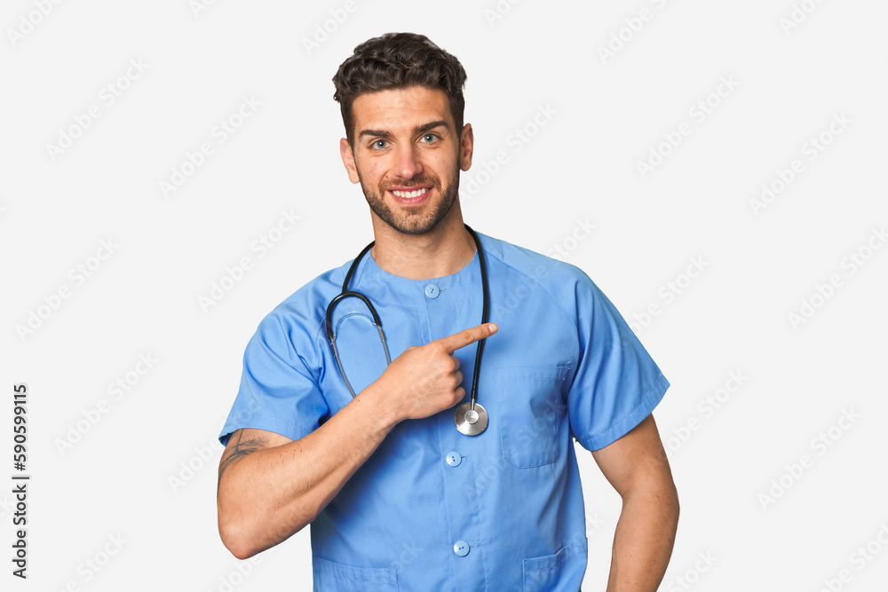 Young nurse man smiling and pointing aside, showing something at blank space. Young nurse man smiling and pointing aside, showing something at blank space.