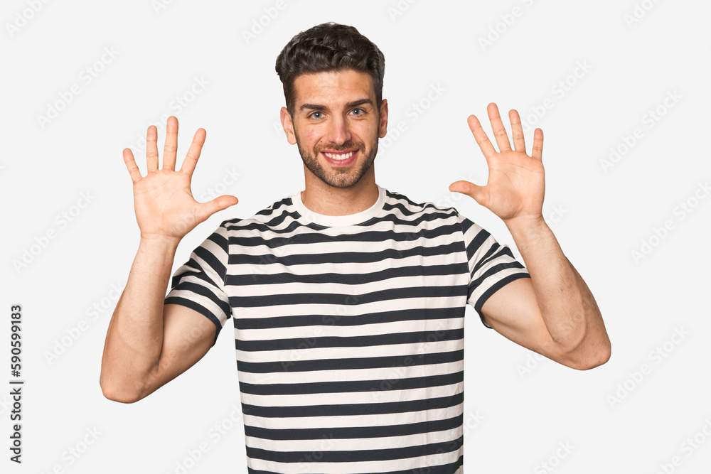 Young handsome man isolated showing number ten with hands. Young handsome man isolated showing number ten with hands.