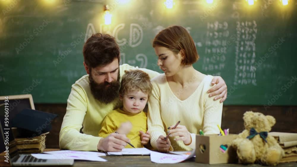 Father and mother teaching children at school. Education family and ...