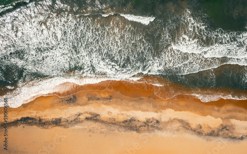 Aerial view of ocean waves on the shore of Sri Lanka