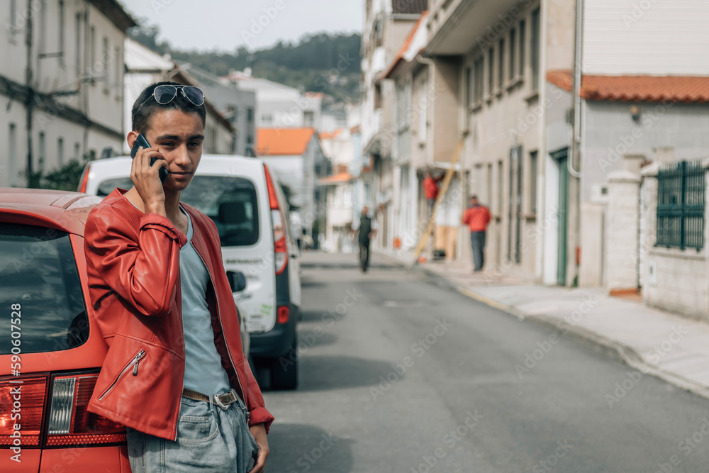Fototapeta premium urban young man in the street with mobile phone