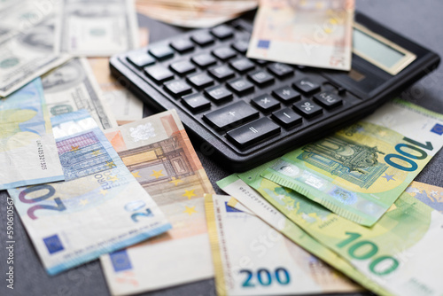 Different money in banknotes of 100 euro, 100 dollars and Russian ruble as background. View from above. © Angelov