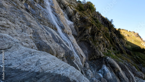 pretty mountain ridge highland fast waterfall at summertime day - photo of nature