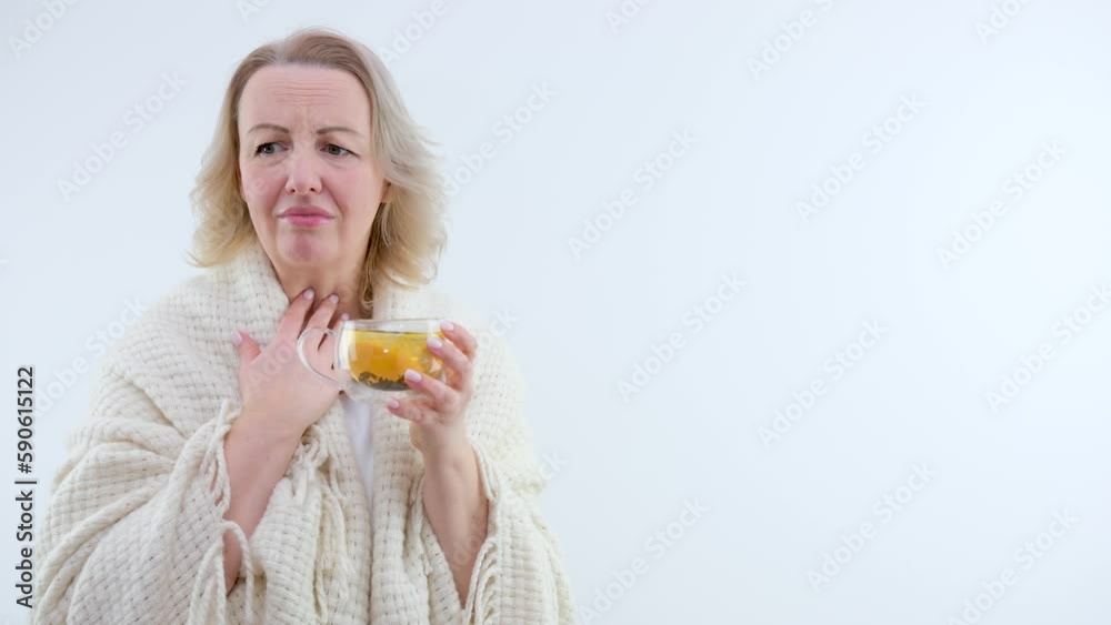 Frozen young woman with cup of hot tea warming near electric heater at home our tea will fly out from various diseases and help you better understand yourself Frozen young woman with cup of hot tea warming near electric heater at home our tea will fly out from various diseases and help you better understand yourself