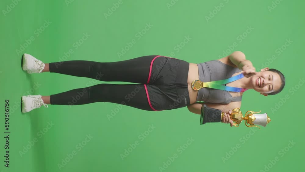 Full Body Of Asian Woman With A Gold Medal And Trophy Touching Her ...