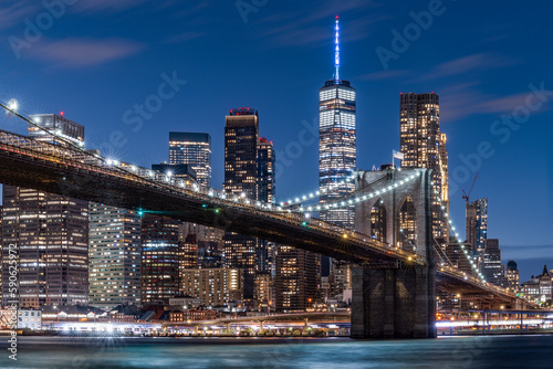 Brooklyn Bridge and Lower Manhattan skyline at night, New York City, USA photo