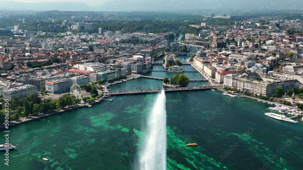 Flight over sunny geneva central cityscape lakeside fountain rooftop aerial panorama 4k switzerland