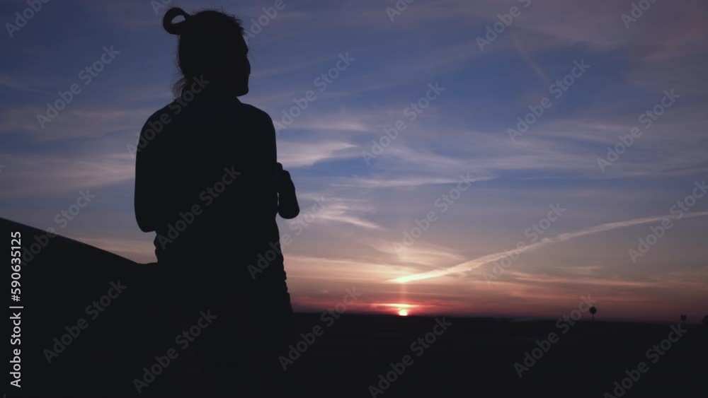 Girl At Sunset Looks Through Binoculars Near The Road Girl At Sunset Looks Through Binoculars Near The Road